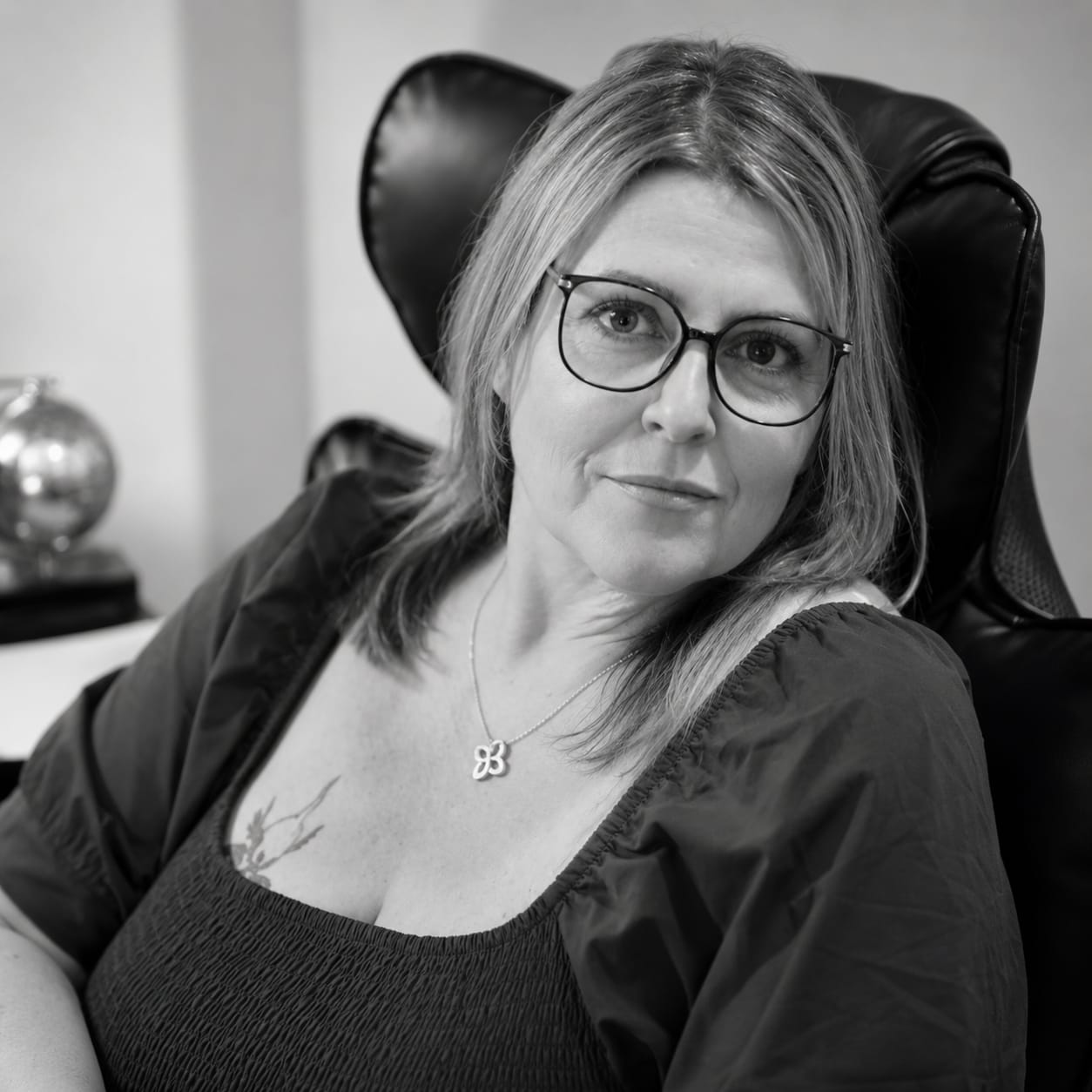 Caroline Reed seated in her therapy practice